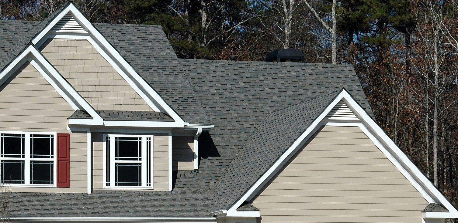 A modern house with triangle gable vents installed in the gable peak.