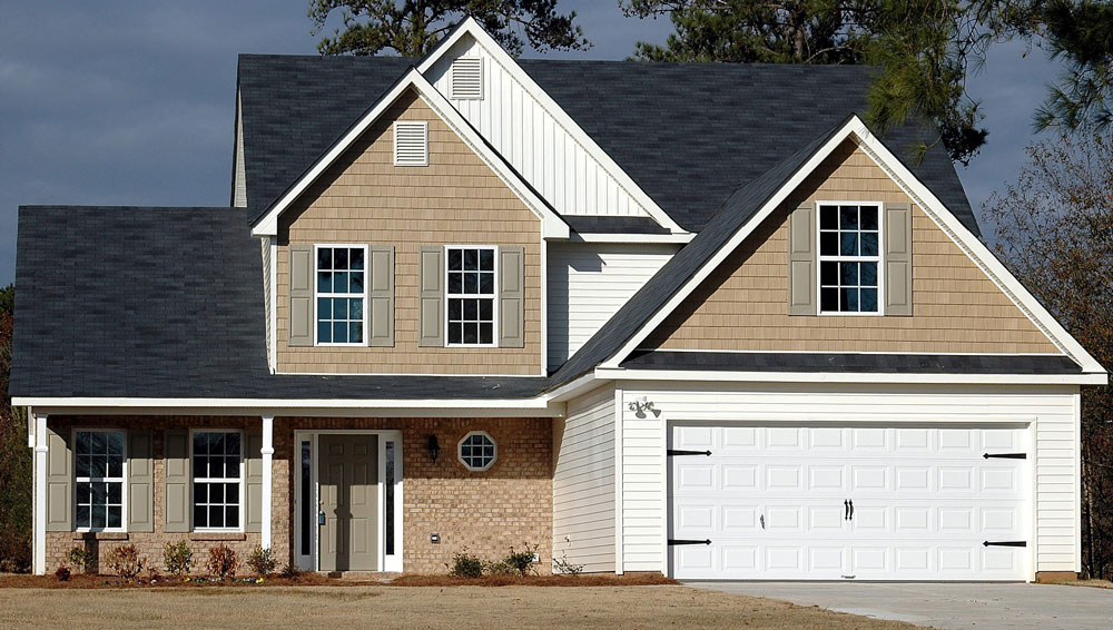 Modern Northern home complemented by rectangle gable vents and shutters.