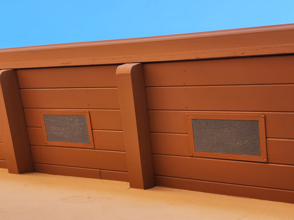 Rectangle Vulcan vents installed on the underside of the roofs overhang.