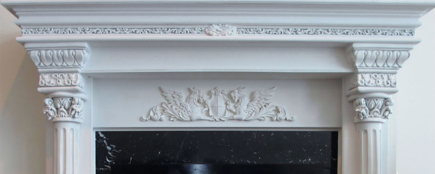A Fireplace mantel with decorative Onlays & Appliques